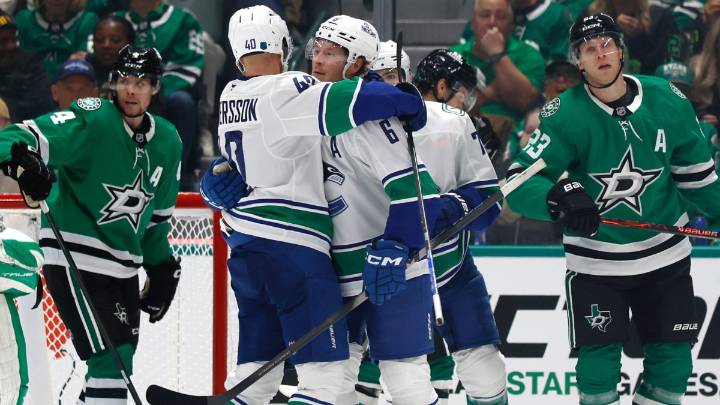 Canucks rally behind 3 quick goals, hand Stars the first loss of the season