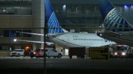 Passenger arrested after trying to open airplane door at Bush Airport, officials say