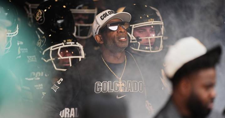 Colorado fans storm field after win over No. 22 Iowa State, Deion Sanders loves it but fine may loom