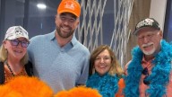 Taylor Swift’s Fiancé Travis Kelce Turns Heads In Orange At Showgirl Release Party