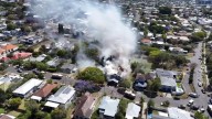 Fire crews battle blaze at two-storey home in Coorparoo