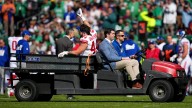 Cam Skattebo taken to hospital with dislocated ankle