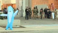 Tourists join costumed protesters at ICE facility
