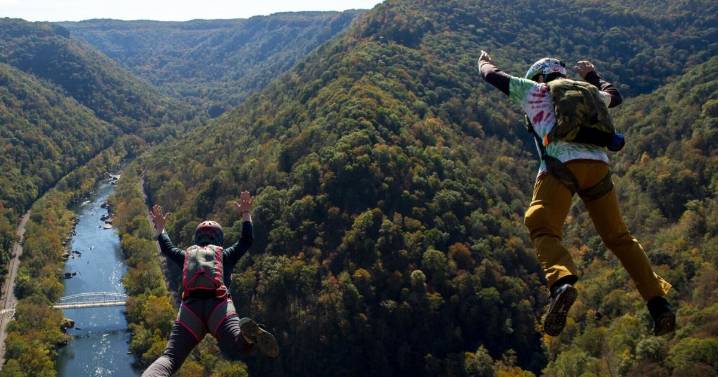 Hundreds of parachutists take the 876-foot plunge on Bridge Day in Fayetteville