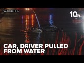 Driver taken to hospital after vehicle falls into water in Warwick