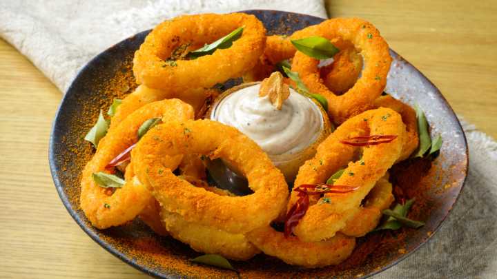 The Baking Ingredient That Will Take Your Homemade Onion Rings To The Next Level