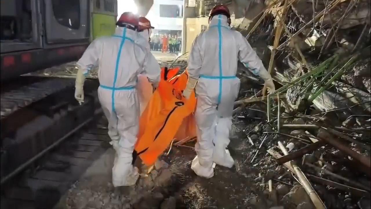 Indonesian rescuers pull more bodies from rubble of collapsed school as death toll rises