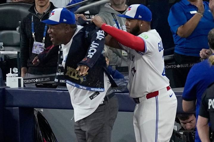 Joe Carter wears Blue Jays’ home run jacket after throwing first pitch at World Series Game 2