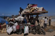 Some Palestinians pack up and move north toward their homes in Gaza after ceasefire goes into effect