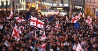 Tens of thousands march against Georgia's government as local election snubbed by opposition held