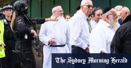 His robe stained with blood, a rabbi led his defiant Manchester congregation in prayer