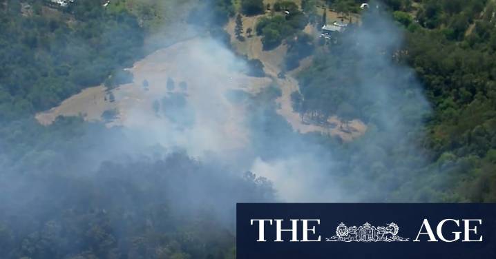 Slow-moving fire threatening properties in Brisbane's north