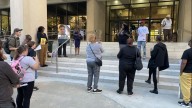 Protestors rally against police brutality on Wednesday evening