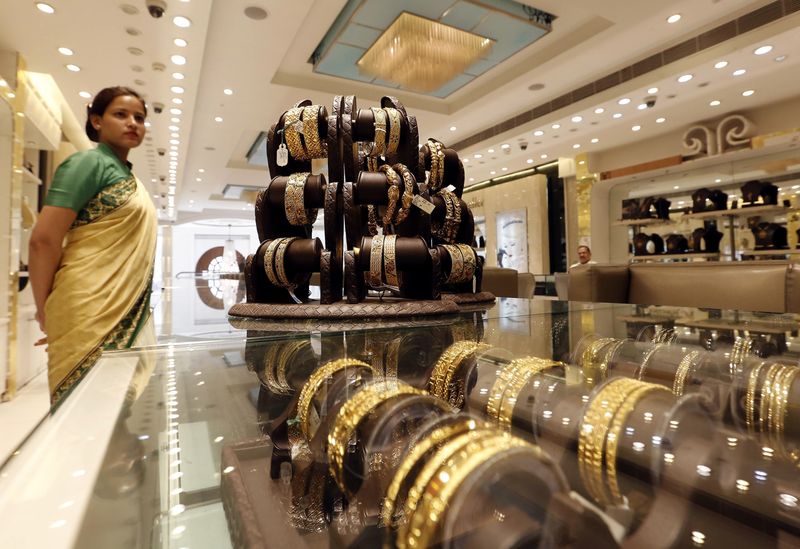 Gold takes a breather after safe-haven demand fuels record run