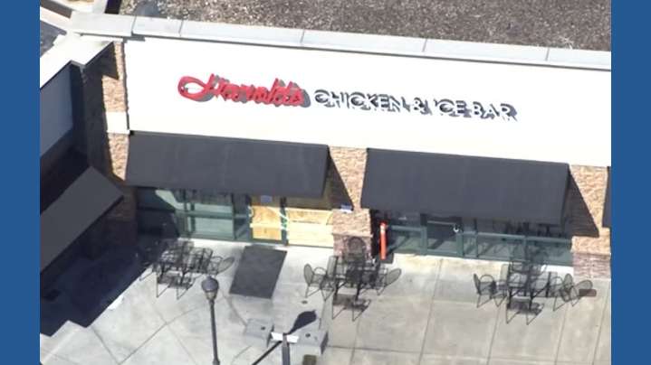 Two people are under arrest for allegedly shooting into a Gwinnett County restaurant