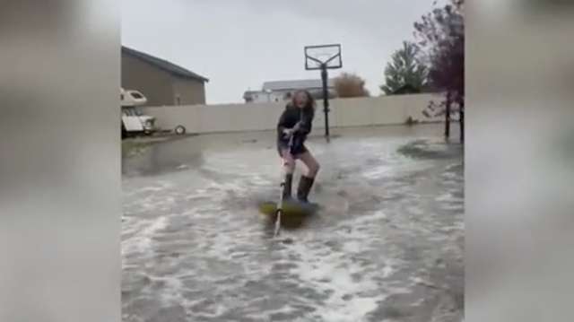VIDEO: Utah family wake surfs in their backyard after record rainfall