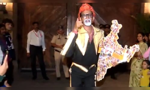 Amitabh Bachchan fans, dressed as characters played by him, celebrate his 83rd birthday outside Jalsa
