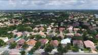 How much do you need to make and save to buy a home in South Florida?