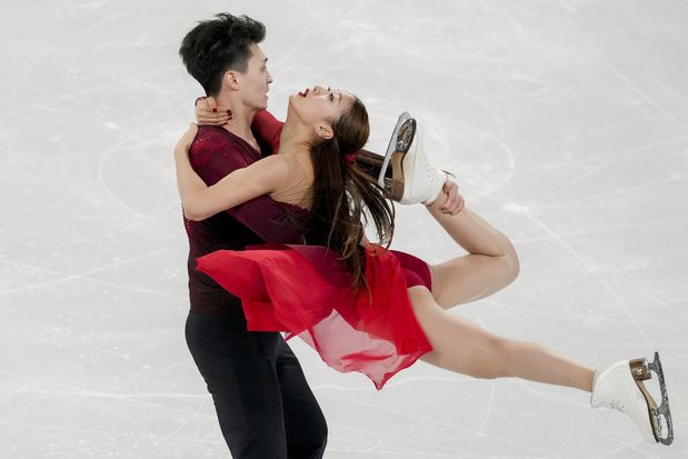 Skating body investigates toy missile seen with Chinese ice dancers