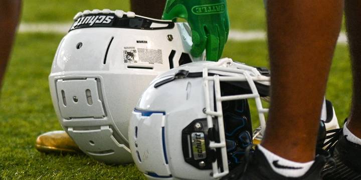 High school football action continues on rain-threatened Friday night across Kansas City