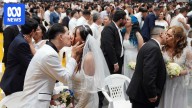 Mass civil wedding in Paraguay's capital sees more than 600 couples say 'I do' in unison