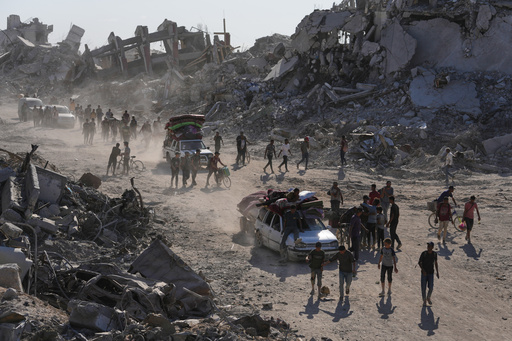 Some Palestinians pack up and move north toward their homes in Gaza after ceasefire goes into effect