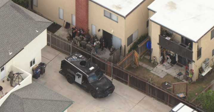 Long Beach police detain person of interest in homicide investigation after standoff in Huntington Beach