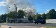 Shreveport firefighters working scene of fire at country club