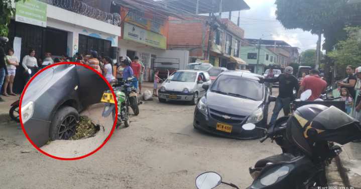 Un carro quedó atrapado en un hueco en el barrio El Salado