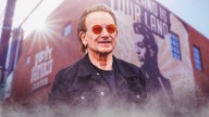 U2’s Bono teases new song from upcoming album at Woody Guthrie Prize celebration