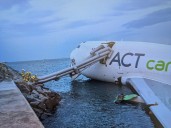 Two killed as cargo plane skids off Hong Kong runway