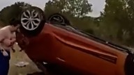 Dramatic moment of police rescuing infant trapped underneath car