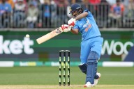 Kohli, Rohit misfire as India labour to 136/9 in rain