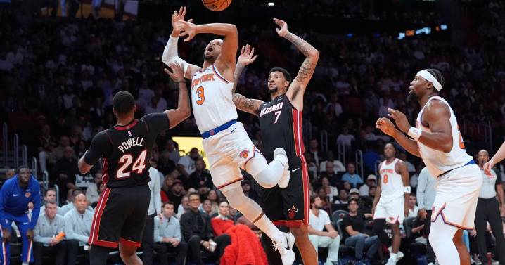 Powell scores 29 as Heat beat Knicks 115-107 in Miami's home opener