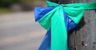 Volunteers preserving ribbons honoring Annunciation victims for student project