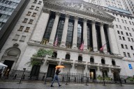 Wall Street recovers some of Friday’s sell-off after Trump softens his criticism of China