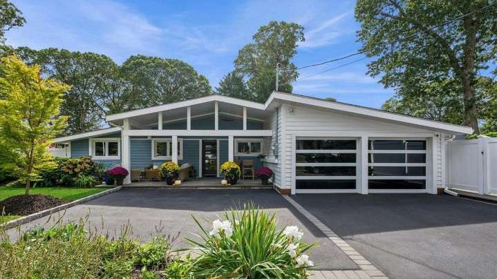 Massapequa house for sale has outdoor living space, one
