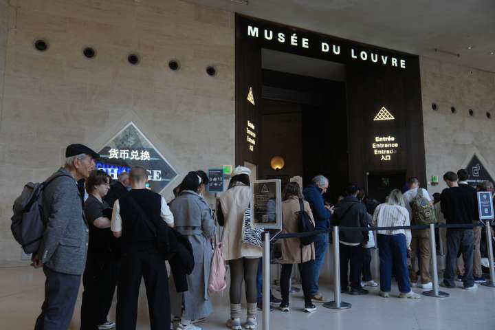 The Louvre reopens three days after thieves took French crown jewels in a daylight heist at the Paris museum