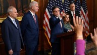 Johnson, in shift, signals no vote during shutdown for military pay
