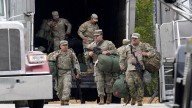 National Guard troops have started their mission in Chicago area, official says, as court showdowns over deployments loom