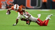 The Latest: Three ranked matchups in the AP Top 25 headline next weekend