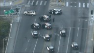 Driver arrested after standoff on 10 Freeway overpass near West Adams