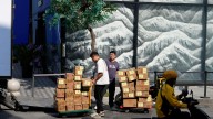 China's economy slows to 4.8% annual growth in July-September, hit by tariffs, slack demand