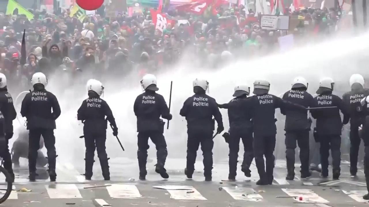 Belgian police use water cannon to move on protesters in Brussels on day of union strike