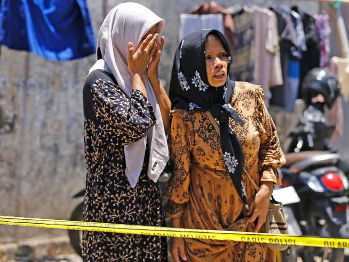 Hope of finding survivors in Indonesia school collapse fades as rescuers turn to heavy machinery