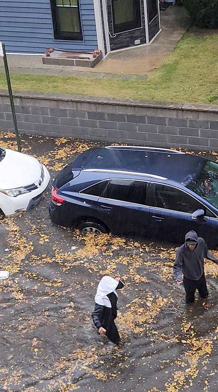 Heavy rains in New York kill two, disrupt flights