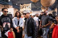 Pharrell mingles with fans, even signs a guitar