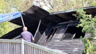 Woman believed to have survived horrific Queensland house fire that killed three people to be questioned by police