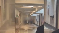 Brown water floods hallway at Quince Orchard High School