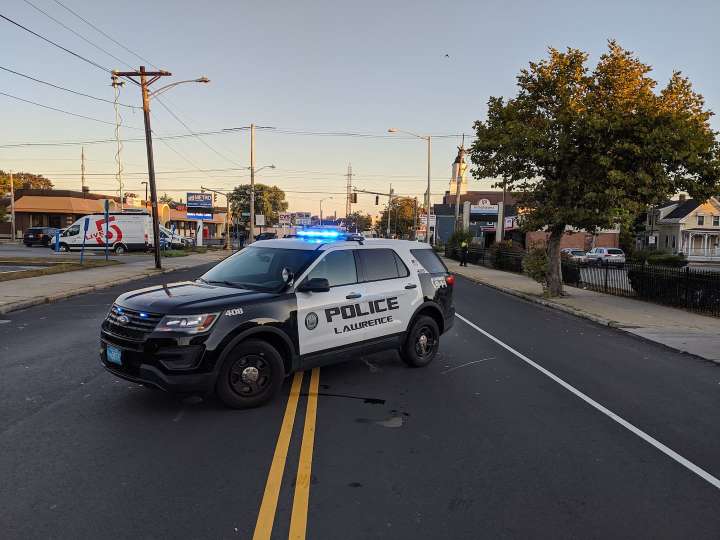Mother killed in Lawrence after getting pinned by vehicle while trying to attend to infant child